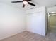 Neutral bedroom with plush carpeting, ceiling fan and closet at 4510 Limerick Dr, Tampa, FL 33610