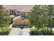 Two-car garage townhome exterior featuring manicured landscaping and charming architectural details at 4510 Limerick Dr, Tampa, FL 33610