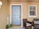Comfortable front porch setting with seating, a window, and neutral tones for a welcoming feel at 4510 Limerick Dr, Tampa, FL 33610