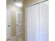 Hallway with bi-fold doors and access to a closet at 4510 Limerick Dr, Tampa, FL 33610