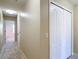 Hallway with closet and open door leading to another room at 4510 Limerick Dr, Tampa, FL 33610
