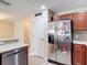 Bright kitchen featuring a stainless steel refrigerator and ample cabinet space at 4510 Limerick Dr, Tampa, FL 33610