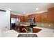 Open kitchen layout featuring stainless steel appliances, ample cabinet space, and granite countertops at 4510 Limerick Dr, Tampa, FL 33610