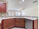 Well-lit kitchen featuring a stainless steel dishwasher, double basin sink, and ample counter space at 4510 Limerick Dr, Tampa, FL 33610