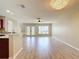 Bright open floor plan with hardwood floors that connects the living area with the kitchen at 4510 Limerick Dr, Tampa, FL 33610