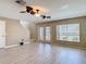 Bright living room featuring modern flooring, ample natural light, and convenient access to the outdoors at 4510 Limerick Dr, Tampa, FL 33610