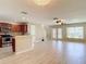 Open-concept living area featuring a breakfast bar, stainless steel appliances, and hardwood floors at 4510 Limerick Dr, Tampa, FL 33610