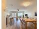 Bright, open living space with modern light fixtures, and a dining area with seating at 4510 Limerick Dr, Tampa, FL 33610