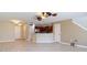 Open-concept living room that flows into the kitchen, with tiled floors and modern lighting at 4510 Limerick Dr, Tampa, FL 33610
