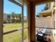 Screened patio features lawn views and relaxing seating under a clear, sunny sky at 4510 Limerick Dr, Tampa, FL 33610