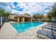 Community pool area features a covered lounge, sun loungers, and a sparkling pool for residents at 4510 Limerick Dr, Tampa, FL 33610