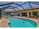 Lovely pool featuring a screened lanai for enjoying the Florida weather, and outdoor lounging at 1928 Cove Pointe Drive, Venice, FL 34293