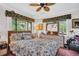 A beautifully decorated bedroom with a bright decor and view to the outdoors at 1001 Old Mill Pond Rd, Palm Harbor, FL 34683