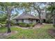 Charming single-story home nestled amongst mature trees with well-maintained landscaping at 1001 Old Mill Pond Rd, Palm Harbor, FL 34683
