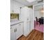 Efficient kitchen layout with white refrigerator and convenient access to the dining area at 1001 Old Mill Pond Rd, Palm Harbor, FL 34683