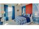 Bedroom featuring soccer themed decor, blue accents, and a large window for natural light at 30872 Wild Juniper Ct, Brooksville, FL 34602