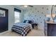 Bedroom featuring star decals, a black and white color scheme, and modern furniture at 30872 Wild Juniper Ct, Brooksville, FL 34602
