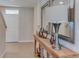 Inviting foyer featuring tile flooring, complemented by an elegant console table with decorative accents at 30872 Wild Juniper Ct, Brooksville, FL 34602