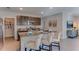 Modern kitchen featuring a center island with bar seating and granite countertops, and stainless steel appliances at 30872 Wild Juniper Ct, Brooksville, FL 34602