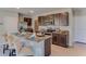 Well-equipped kitchen featuring stainless steel appliances, granite countertops and a functional center island at 30872 Wild Juniper Ct, Brooksville, FL 34602