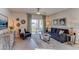 Comfortable living room features plush seating, stylish decor, and sliding glass doors leading to outdoor space at 30872 Wild Juniper Ct, Brooksville, FL 34602