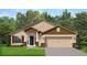 Charming single-story home featuring a symmetrical facade, a two-car garage and manicured front lawn at 4904 Sutherland St # Lot 66, Spring Hill, FL 34609