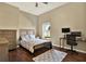Comfortable bedroom with modern desk, chair, and ceiling fan at 12494 Moon Rd, Brooksville, FL 34613