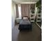 Cozy bedroom with a single bed, bedside table, decorative items, and a window for natural light at 9685 Southern Belle Dr, Weeki Wachee, FL 34613