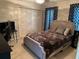 Comfortable bedroom with closet, desk, and stylish upholstered bed at 9685 Southern Belle Dr, Weeki Wachee, FL 34613