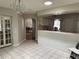 Open dining area next to kitchen features tile floors, chandelier, and French doors at 9685 Southern Belle Dr, Weeki Wachee, FL 34613
