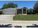 Charming single-story home with a two-car garage, well-manicured lawn, and inviting curb appeal at 9685 Southern Belle Dr, Weeki Wachee, FL 34613