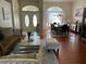 Spacious living room and dining room area with hardwood floors, elegant decor and plenty of natural light at 9685 Southern Belle Dr, Weeki Wachee, FL 34613