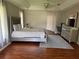 Spacious primary bedroom with hardwood floors, providing a restful retreat at 9685 Southern Belle Dr, Weeki Wachee, FL 34613