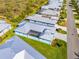 Aerial view of lovely homes in a well-maintained community with lush green lawns at 10391 Coquina Ct, Placida, FL 33946