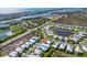 Aerial view shows the surrounding neighborhood, water features, and coastal proximity at 10391 Coquina Ct, Placida, FL 33946