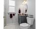 This bathroom features a new toilet, granite countertops, and modern fixtures at 10391 Coquina Ct, Placida, FL 33946
