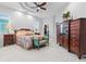 Main bedroom featuring a tray ceiling, plantation shutters, and walk-in closet at 10391 Coquina Ct, Placida, FL 33946