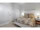 This bedroom features a floral comforter, white walls, and clean flooring at 10391 Coquina Ct, Placida, FL 33946