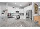 Spacious kitchen featuring granite countertops, white cabinetry, and stainless steel appliances at 10391 Coquina Ct, Placida, FL 33946