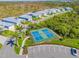 Overhead view of two well-maintained tennis courts in a lovely community setting at 10391 Coquina Ct, Placida, FL 33946