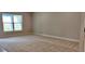 Spacious bedroom with carpet flooring, ample natural light, and neutral wall color at 13243 Gulf Bay Ln, Spring Hill, FL 34609