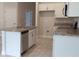 Stylish kitchen with stainless steel appliances, light countertops and cabinets, and a kitchen island at 13243 Gulf Bay Ln, Spring Hill, FL 34609