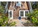 Wooden deck with plants in front of A-frame home at 8309 Oakgren Rd, Brooksville, FL 34601