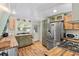 Charming kitchen featuring wooden countertops, stainless steel appliances, and rustic-style cabinetry at 8309 Oakgren Rd, Brooksville, FL 34601