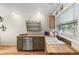 Bright kitchen with wooden countertops, stainless steel dishwasher, and farmhouse style sink at 8309 Oakgren Rd, Brooksville, FL 34601