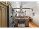Lovely kitchen featuring a stainless steel refrigerator, and cozy rustic style at 8309 Oakgren Rd, Brooksville, FL 34601