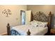 Charming bedroom with decorative bed frame and neutral decor at 1138 Lumsden Trace Cir, Valrico, FL 33594