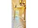 Light-filled foyer with decorative tile flooring, ceiling fan, and sliding glass doors to the backyard at 1138 Lumsden Trace Cir, Valrico, FL 33594