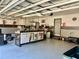 Spacious garage with ample storage space and a workbench for projects at 1138 Lumsden Trace Cir, Valrico, FL 33594