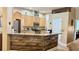 Well-lit kitchen features wood cabinets, modern appliances, and counter with wood accent at 1138 Lumsden Trace Cir, Valrico, FL 33594